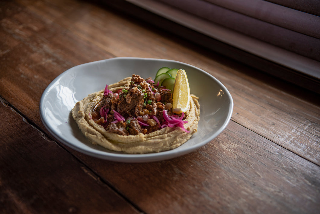 BRAISED BEEF ON HUMMUS
